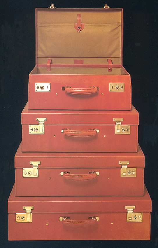 This magnificent striped steamer trunk from the Louis Vuitton brand mixes  solid brass and leather